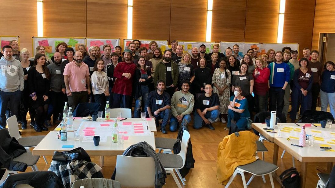 around 60 workers gathered at conference